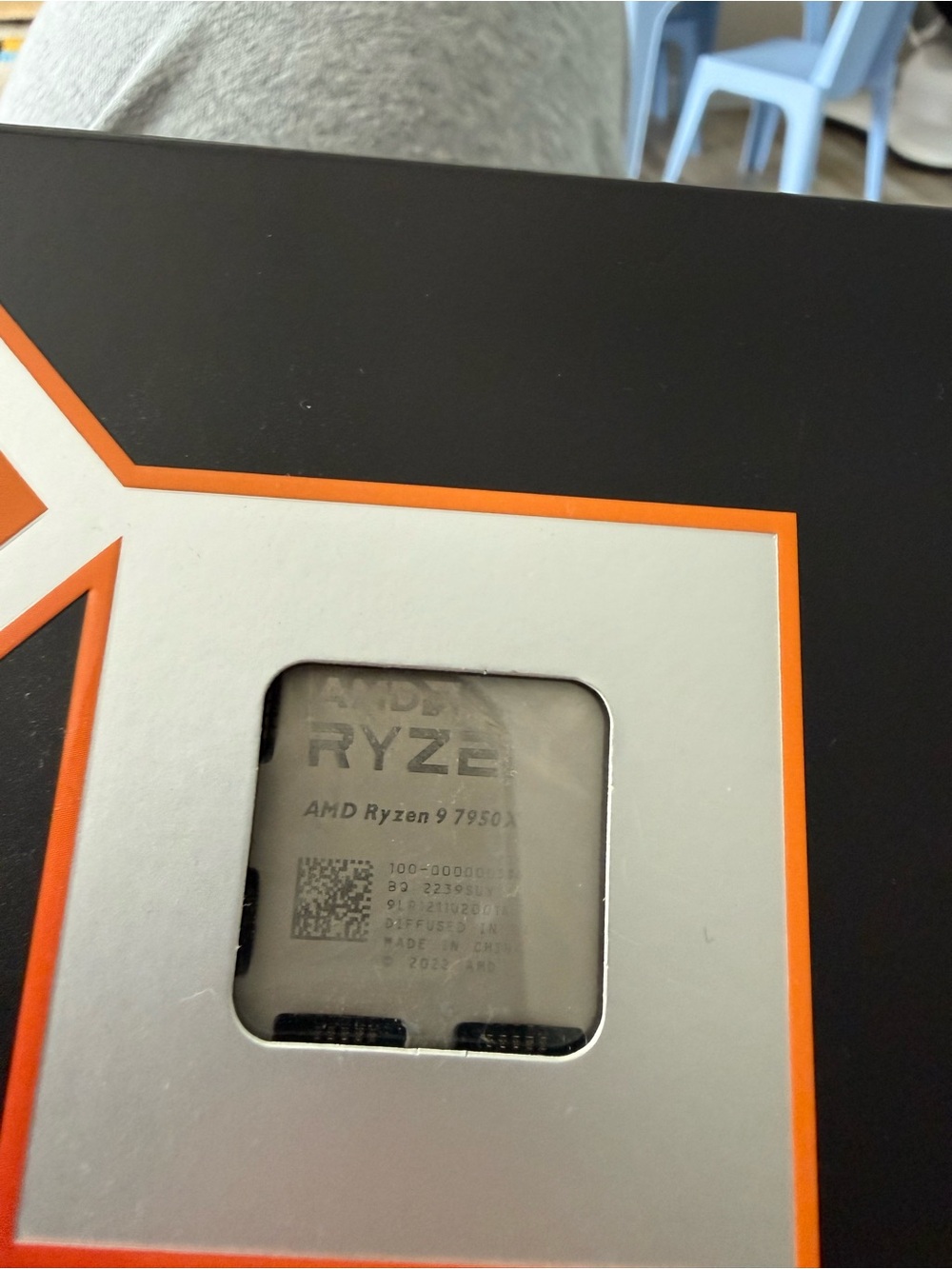 AMD Ryzen 9 CPU with Orange and Silver Accents